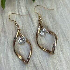 Twisted gold tone dangle faceted rhinestones earrings
